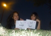 send you 3 photos of me and my twin sister, holding your sign 